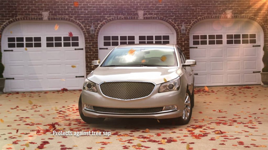 Gold sedan in front of a garage showing how ResistAll will protect the vehicle from the elements